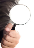 magnifying glass in hand